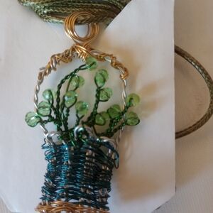 Handcrafted Wire Wrapped Pendant with Green Accents